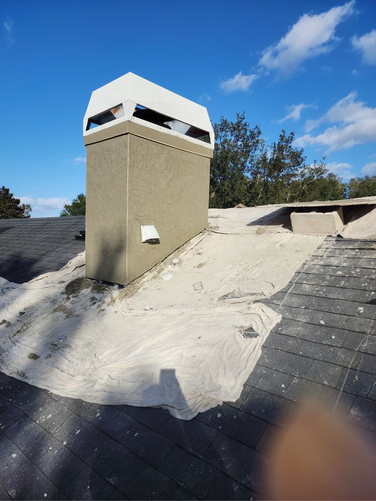 Chimney stucco repair detail showing professional workmanship