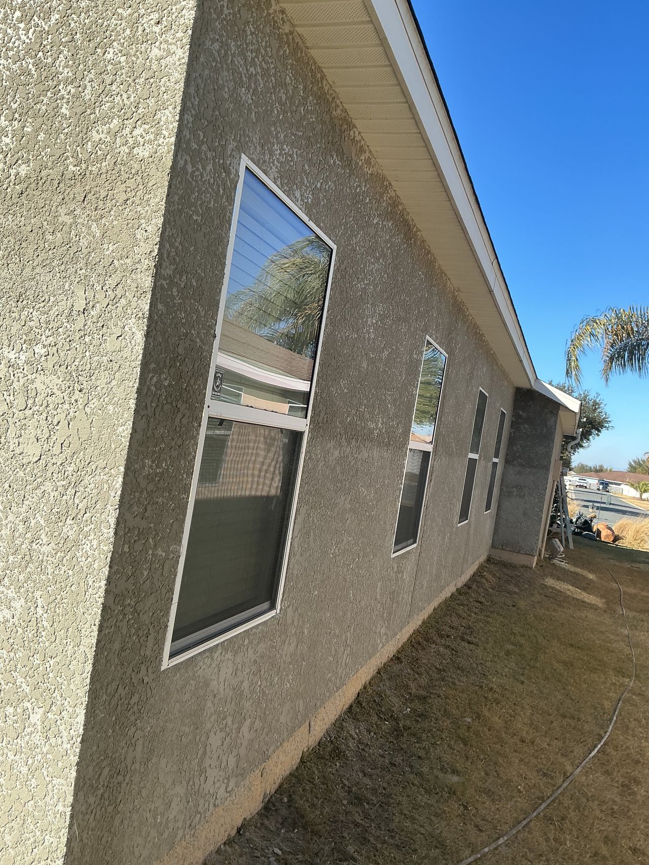 Residential exterior stucco on house side elevation
