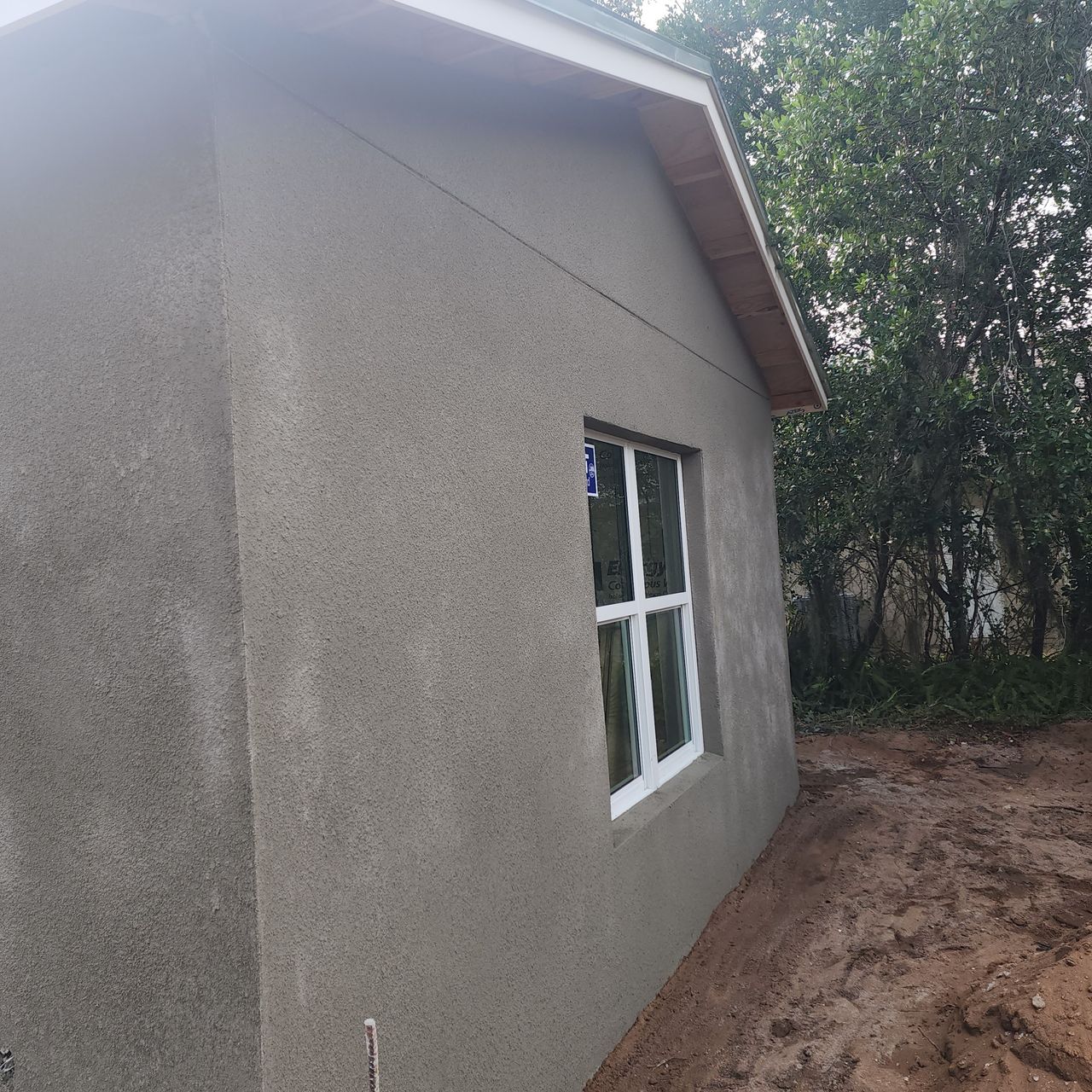 New construction stucco finish on residential exterior